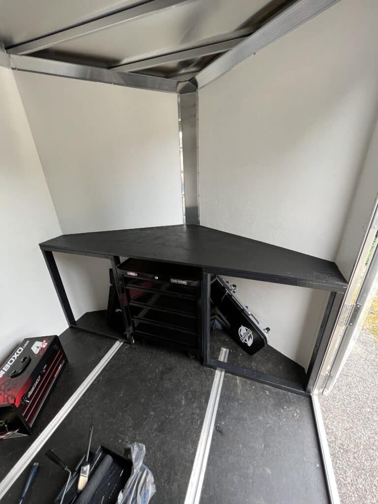 Black bench in enclosed trailer being built