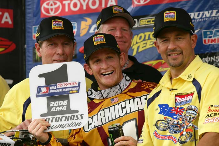 ricky carmichael and team holding up champship trophy