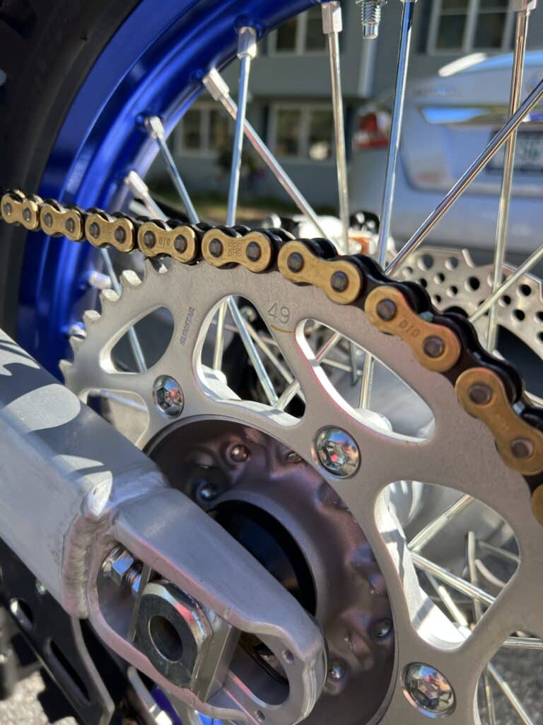 Rear sprocket and chain on a YZ125